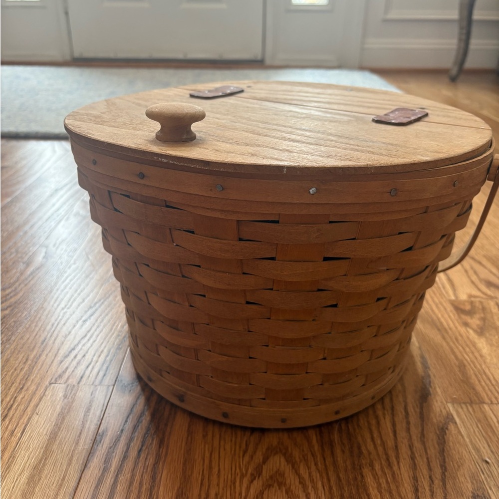Longaberger large sewing basket from 1987 and tiny handle basket from 1989.